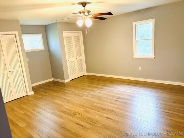 3622 S 82nd E Ave, Tulsa, OK 74145 - unfurnished bedroom featuring multiple closets, light wood-style floors, and a ceiling fan