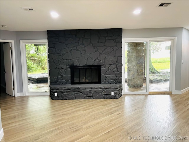 3622 S 82nd E Ave, Tulsa, OK 74145 - unfurnished living room featuring wood finished floors and a fireplace