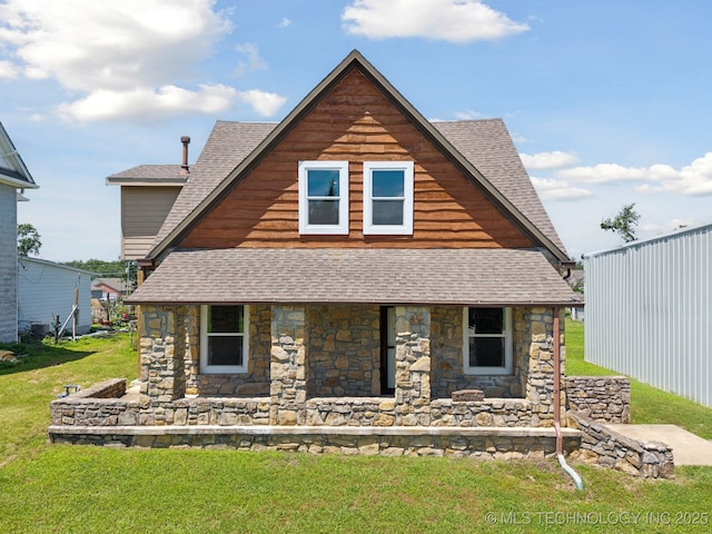 521 S Chickasaw Ave, Claremore, OK 74017 - view of front of property featuring a shingled roof, stone siding, and a front lawn