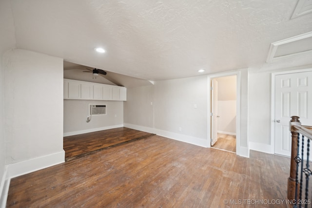521 S Chickasaw Ave, Claremore, OK 74017 - unfurnished living room featuring ceiling fan, hardwood / wood-style flooring, a textured ceiling, recessed lighting, and attic access