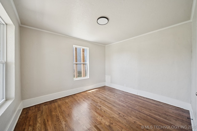 521 S Chickasaw Ave, Claremore, OK 74017 - spare room featuring ornamental molding and wood finished floors
