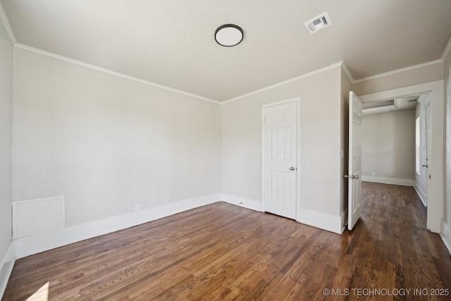 521 S Chickasaw Ave, Claremore, OK 74017 - unfurnished bedroom featuring wood finished floors and crown molding