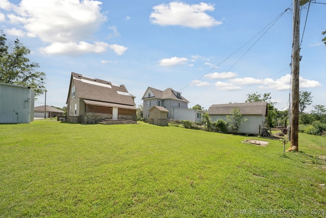 521 S Chickasaw Ave, Claremore, OK 74017 - view of green lawn featuring an outdoor structure