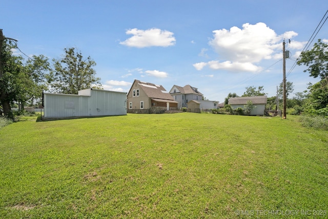 521 S Chickasaw Ave, Claremore, OK 74017 - view of green lawn with an outbuilding