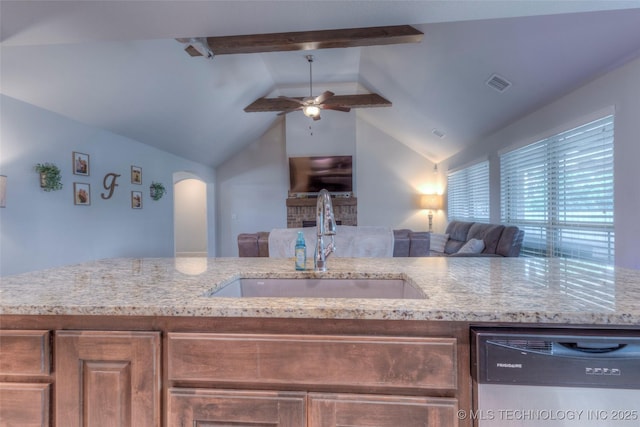 5440 Skylane Pl, Sand Springs, OK 74063 - kitchen with stainless steel dishwasher, open floor plan, a ceiling fan, and light stone countertops