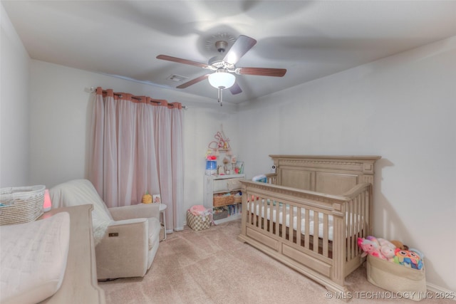 5440 Skylane Pl, Sand Springs, OK 74063 - bedroom featuring a nursery area, light carpet, and a ceiling fan