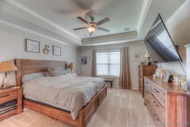 5440 Skylane Pl, Sand Springs, OK 74063 - bedroom featuring a tray ceiling, light carpet, ornamental molding, and a ceiling fan