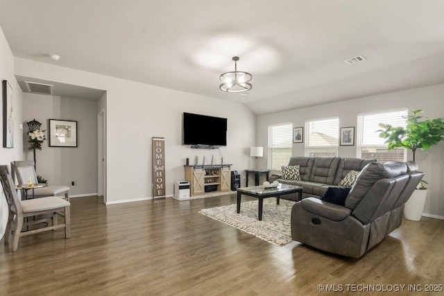 7506 E 159th St S, Bixby, OK 74008 - living area featuring wood finished floors and a chandelier