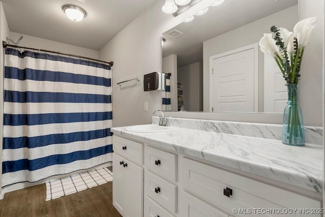 7506 E 159th St S, Bixby, OK 74008 - bathroom featuring vanity, wood finished floors, and curtained shower