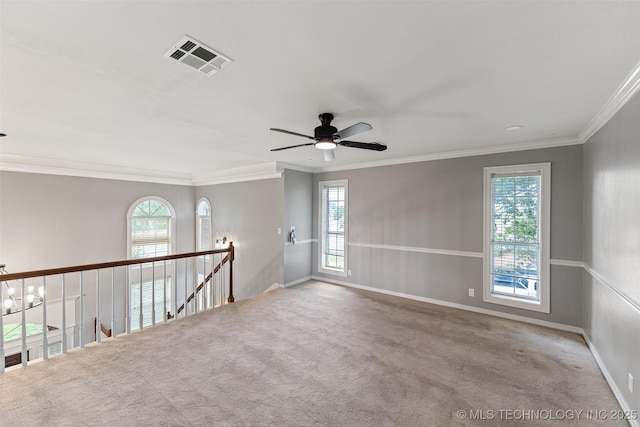 10295 E Rose Glen Dr, Claremore, OK 74019 - spare room featuring ceiling fan, plenty of natural light, crown molding, and carpet floors