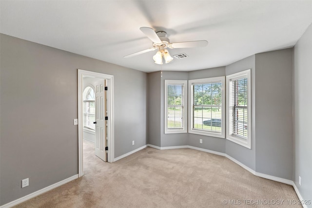 10295 E Rose Glen Dr, Claremore, OK 74019 - empty room with light carpet and ceiling fan