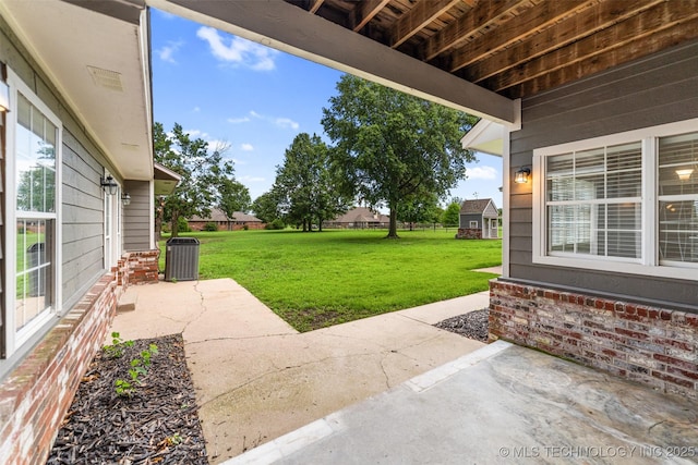 10295 E Rose Glen Dr, Claremore, OK 74019 - view of green lawn with a patio area