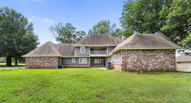 10295 E Rose Glen Dr, Claremore, OK 74019 - rear view of property with a balcony, a yard, brick siding, and roof with shingles