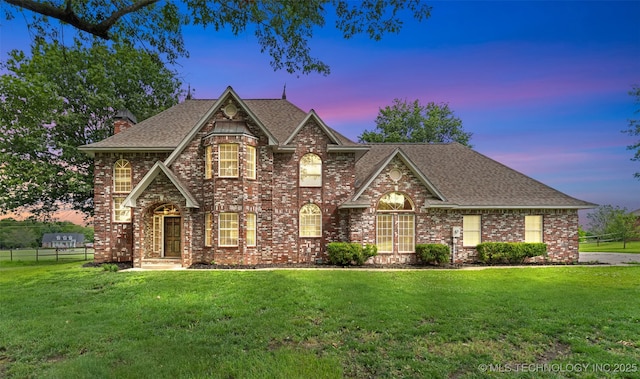10295 E Rose Glen Dr, Claremore, OK 74019 - view of front of property with a shingled roof, brick siding, and a chimney