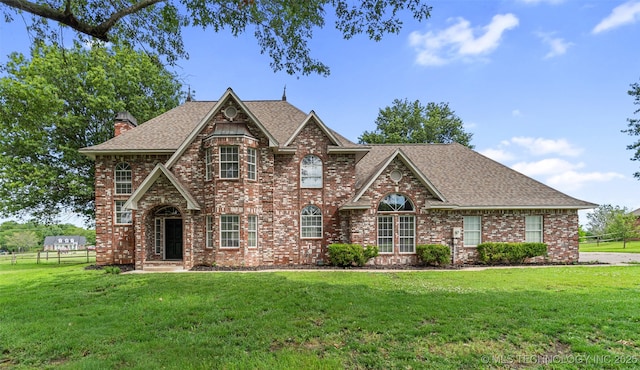 10295 E Rose Glen Dr, Claremore, OK 74019 - view of front of property with brick siding, roof with shingles, and a chimney