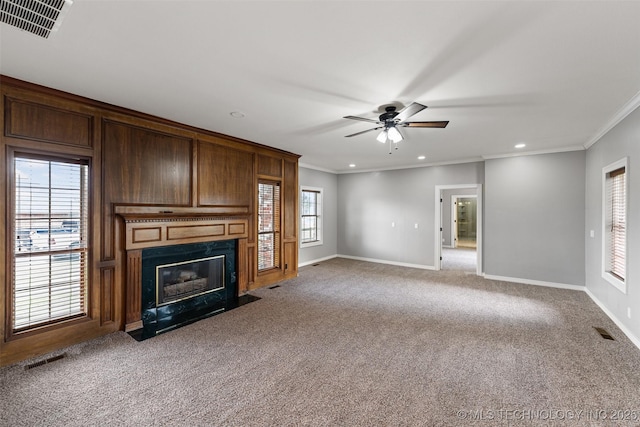 10295 E Rose Glen Dr, Claremore, OK 74019 - unfurnished living room with carpet flooring, crown molding, a high end fireplace, a ceiling fan, and recessed lighting