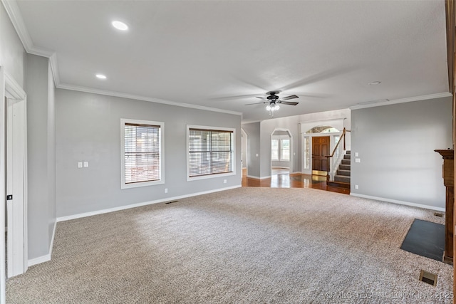 10295 E Rose Glen Dr, Claremore, OK 74019 - unfurnished living room featuring carpet flooring, stairway, a ceiling fan, ornamental molding, and arched walkways