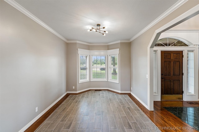 10295 E Rose Glen Dr, Claremore, OK 74019 - empty room featuring a chandelier, wood finished floors, and ornamental molding