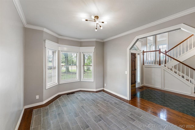 10295 E Rose Glen Dr, Claremore, OK 74019 - unfurnished room featuring plenty of natural light, wood finished floors, stairway, arched walkways, and crown molding