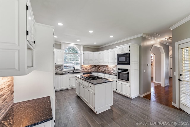 10295 E Rose Glen Dr, Claremore, OK 74019 - kitchen featuring black appliances, decorative backsplash, white cabinets, arched walkways, and crown molding