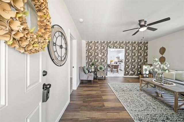 207 N Graham Ave, Wagoner, OK 74467 - entryway with a ceiling fan, dark wood-type flooring, and an accent wall