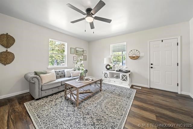 207 N Graham Ave, Wagoner, OK 74467 - living area with a ceiling fan and dark wood-style floors