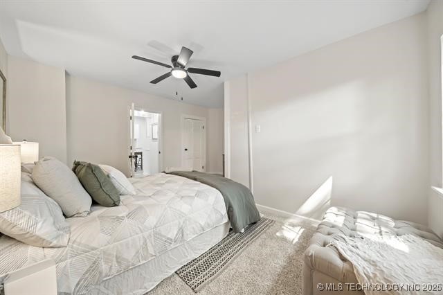 207 N Graham Ave, Wagoner, OK 74467 - carpeted bedroom with ceiling fan
