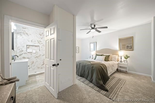 207 N Graham Ave, Wagoner, OK 74467 - bedroom featuring ensuite bath, light carpet, and ceiling fan