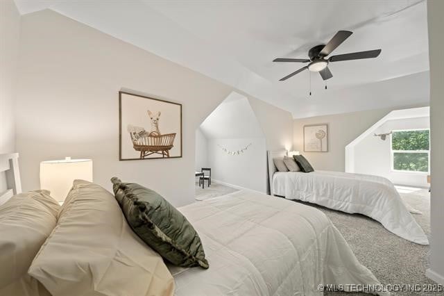 207 N Graham Ave, Wagoner, OK 74467 - bedroom featuring carpet, ceiling fan, and vaulted ceiling