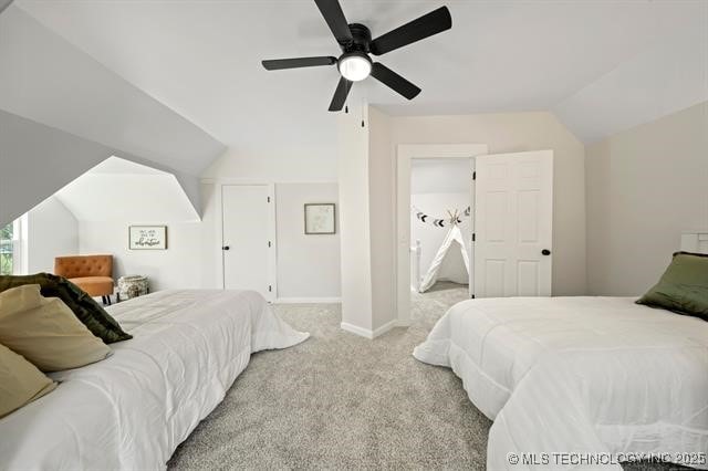 207 N Graham Ave, Wagoner, OK 74467 - carpeted bedroom with lofted ceiling and a ceiling fan