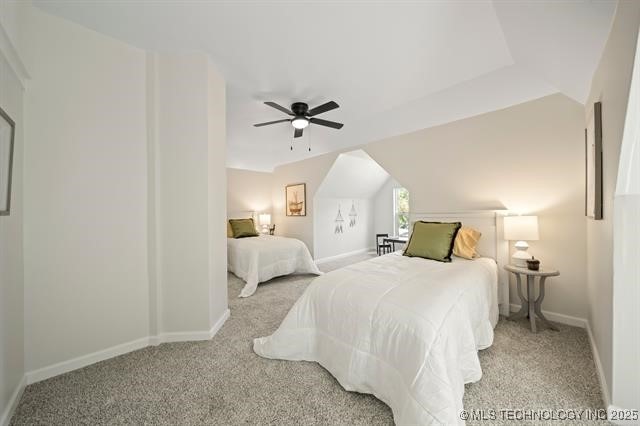 207 N Graham Ave, Wagoner, OK 74467 - carpeted bedroom with baseboards and ceiling fan