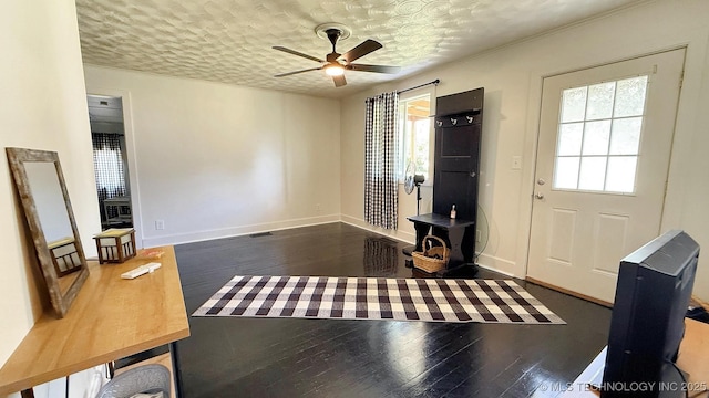 102 N Ash Ave, Tahlequah, OK 74464 - foyer entrance with wood-type flooring, a ceiling fan, and a textured ceiling