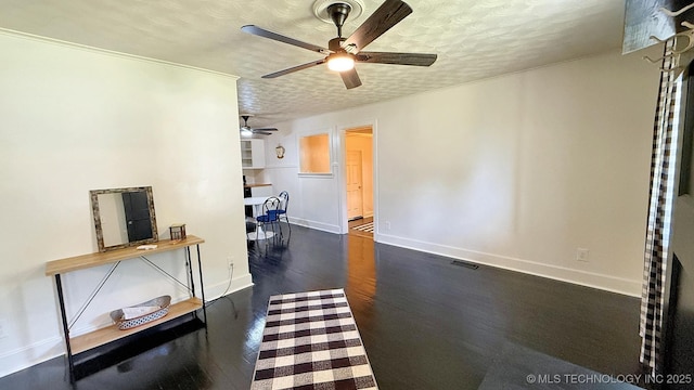 102 N Ash Ave, Tahlequah, OK 74464 - living area with ceiling fan, a textured ceiling, and wood finished floors