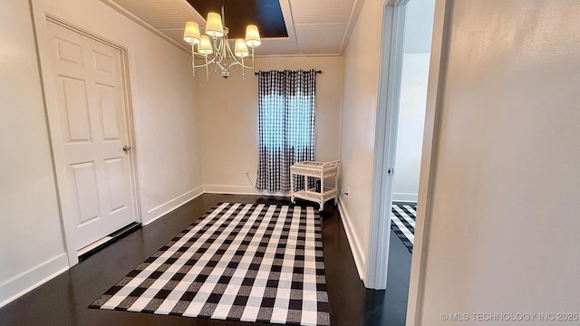 102 N Ash Ave, Tahlequah, OK 74464 - unfurnished dining area with a chandelier and baseboards