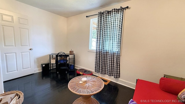 102 N Ash Ave, Tahlequah, OK 74464 - recreation room with baseboards and wood finished floors