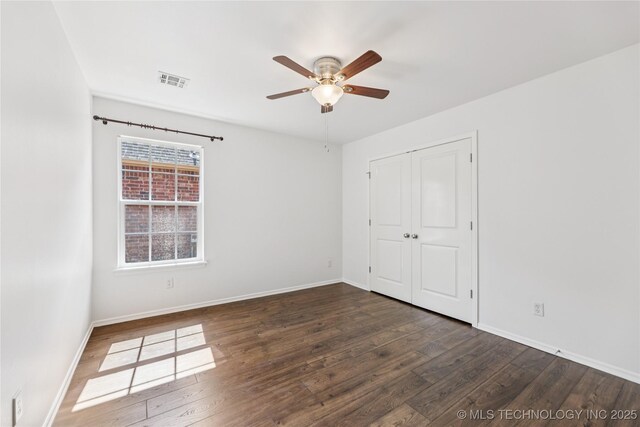 2105 W D Ct, Jenks, OK 74037 - unfurnished bedroom featuring wood finished floors, a closet, and a ceiling fan