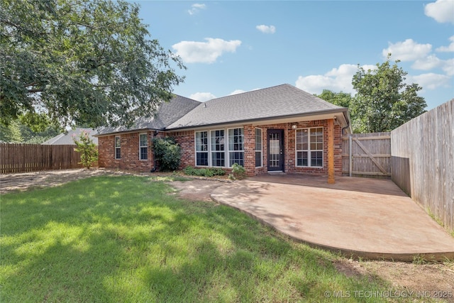 2105 W D Ct, Jenks, OK 74037 - back of property with a fenced backyard, brick siding, and a patio area