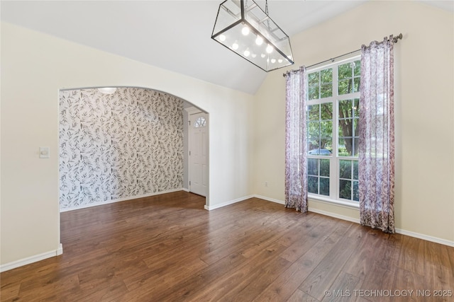 2105 W D Ct, Jenks, OK 74037 - unfurnished room featuring arched walkways, wood finished floors, and vaulted ceiling