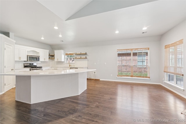 2105 W D Ct, Jenks, OK 74037 - kitchen featuring stainless steel appliances, open shelves, a center island, white cabinetry, and backsplash
