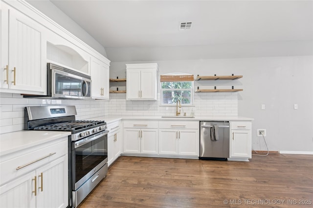 2105 W D Ct, Jenks, OK 74037 - kitchen with open shelves, stainless steel appliances, dark wood-type flooring, and backsplash