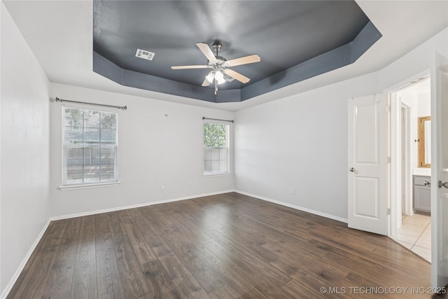 2105 W D Ct, Jenks, OK 74037 - spare room with a raised ceiling, a ceiling fan, and wood finished floors