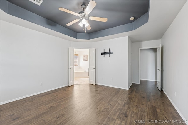 2105 W D Ct, Jenks, OK 74037 - unfurnished room featuring wood finished floors, a ceiling fan, a smoke detector, and a raised ceiling