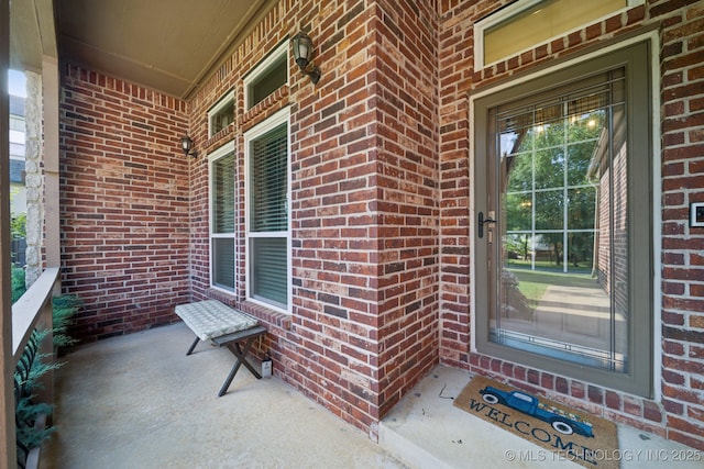 701 E 119th St, Jenks, OK 74037 - property entrance with covered porch and brick siding