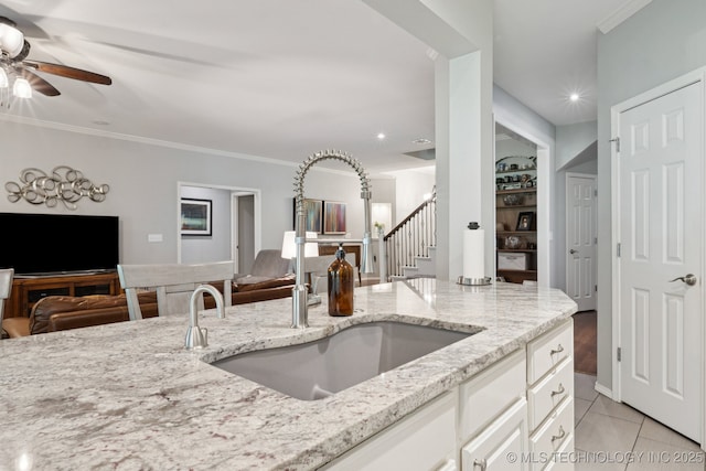 701 E 119th St, Jenks, OK 74037 - kitchen featuring open floor plan, ceiling fan, light stone counters, ornamental molding, and recessed lighting