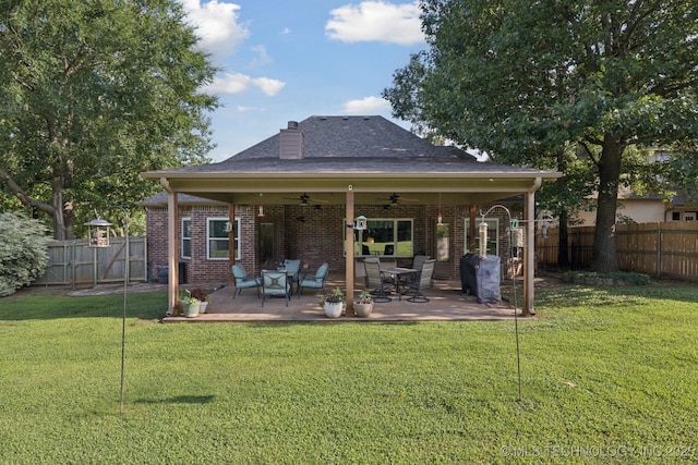 701 E 119th St, Jenks, OK 74037 - rear view of property with ceiling fan, a fenced backyard, brick siding, a patio, and a chimney