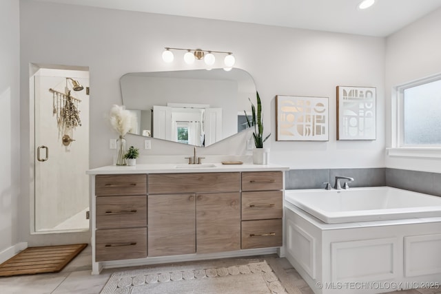 6684 E 128th St S, Bixby, OK 74008 - full bathroom with vanity, a shower stall, and a garden tub