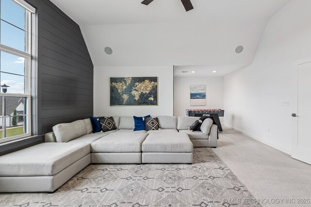 6684 E 128th St S, Bixby, OK 74008 - living area featuring plenty of natural light, light carpet, high vaulted ceiling, a ceiling fan, and wooden walls