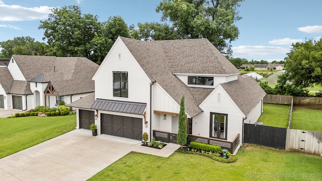 6684 E 128th St S, Bixby, OK 74008 - view of front facade featuring a shingled roof, driveway, an attached garage, and a standing seam roof