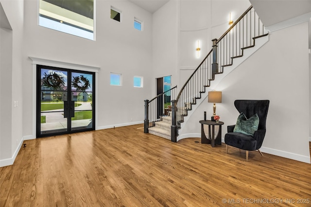 17076 S 31st E Ave, Mounds, OK 74047 - entrance foyer featuring wood finished floors, stairway, and a towering ceiling