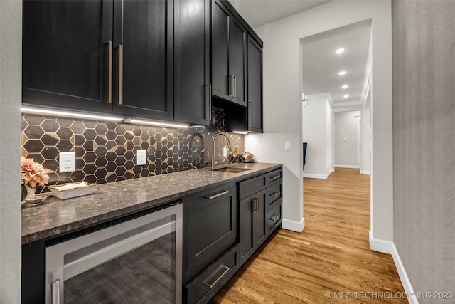 17076 S 31st E Ave, Mounds, OK 74047 - indoor wet bar featuring beverage cooler, light wood finished floors, backsplash, and recessed lighting